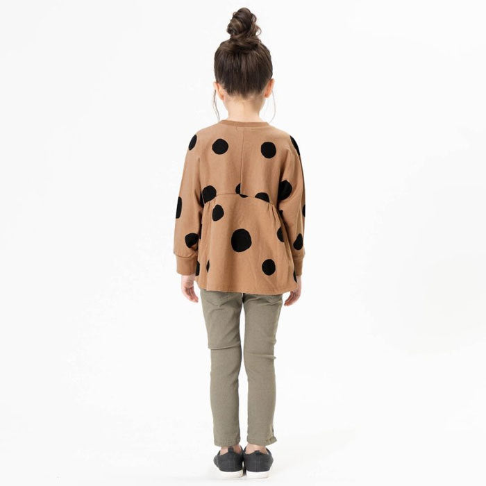 Deformed cut and sew top