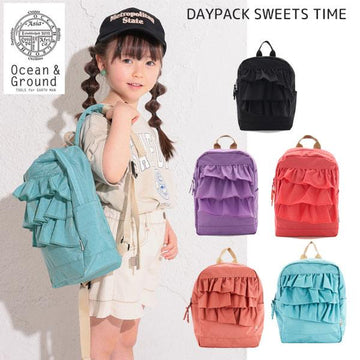 Stylish ruffled nylon backpack for girls with a harness, perfect for kindergarten, elementary school, outdoor activities, camping, and field trips. Ocean &amp; Ground DAYPACK SWEETS TIME